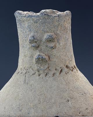 Fragment of pot  with human face 22.01.236